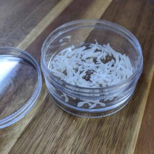 Petri dish with coconut flakes